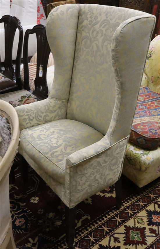 An early 19th century upholstered tub framed armchair